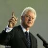Bill Clinton opts for red golf clothing