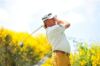 Miguel Angel Jimenez wears mustard golf trousers