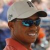 Tiger Woods defeats Rory McIlroy in white golf apparel