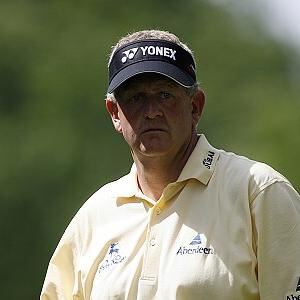 Golfer congratulates fellow player