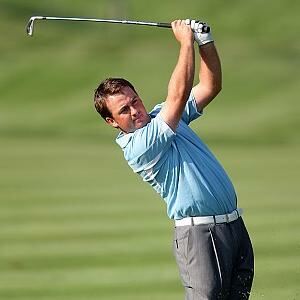 Graeme McDowell wore white and blue golf apparel on the day