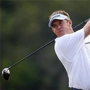Lee Westwood wore white golf apparel