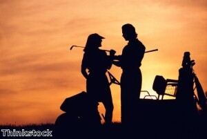 Pink golf apparel has been worn by female golfers for charity.
