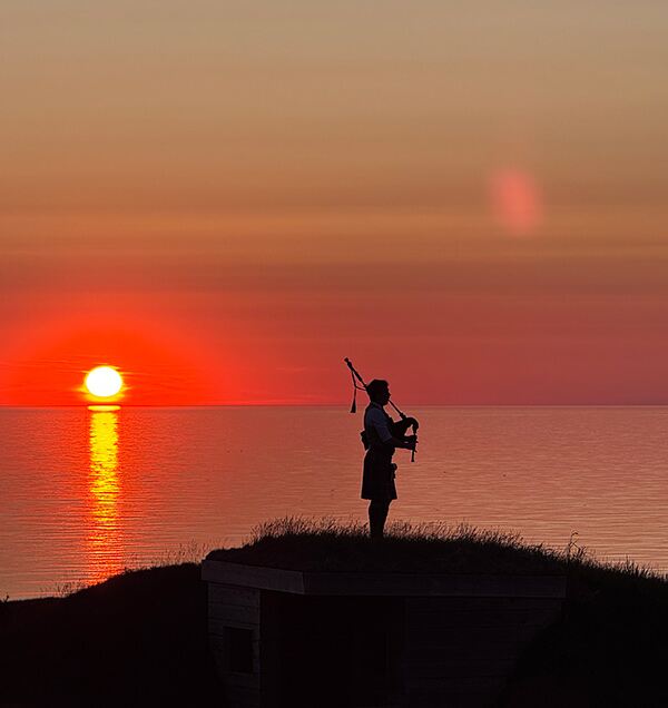 Piper playing at sunset