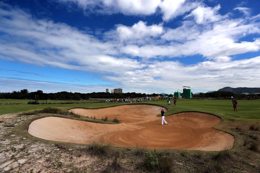 Justin Rose plays out of a bunker during the games. David Davies/PA Wire.
