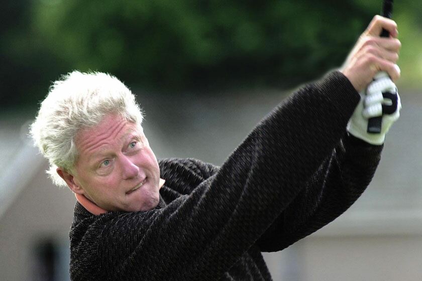 Clinton lets it all out on the course. David Cheskin/PA Archive