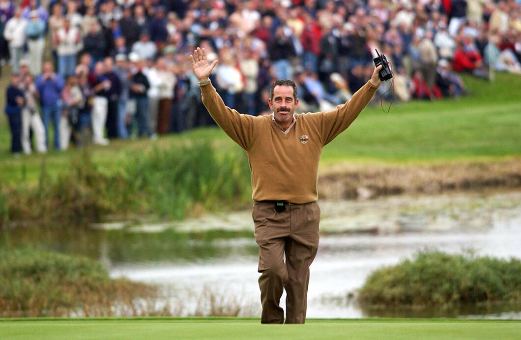 Ryder Cup captain Sam Torrance raises his arms on the 18th green at the Belfry