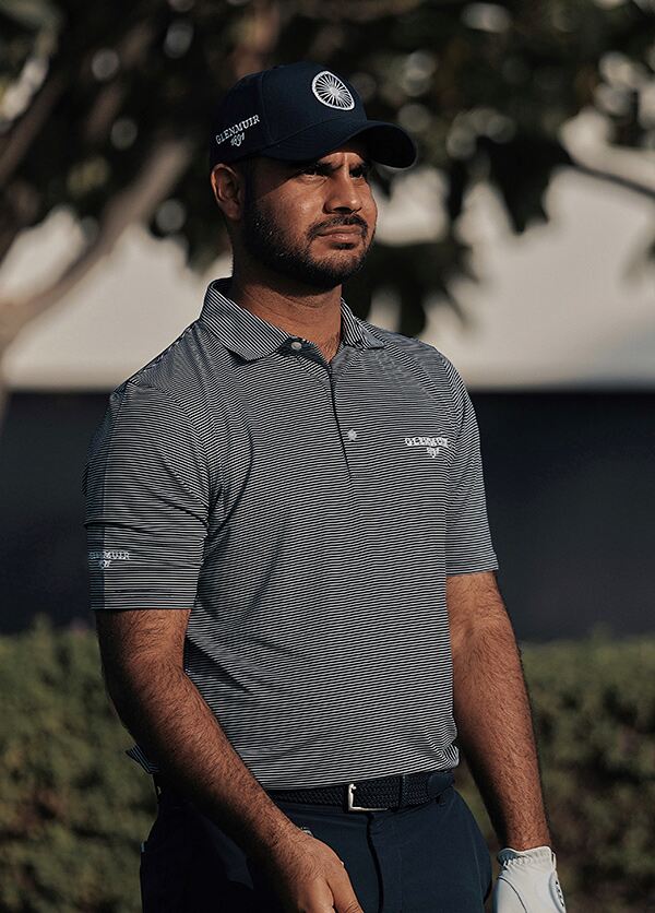 Shubhankar Sharma wears Glenmuir's g.TORRANCE Microstripe Performance Golf Shirt in Navy/White
