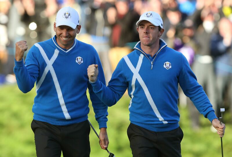 Sergio Garcia (left) sporting Glenmuir’s Ryder Cup Cashmere Zip Neck Sweater. Andrew Milligan/PA Wire