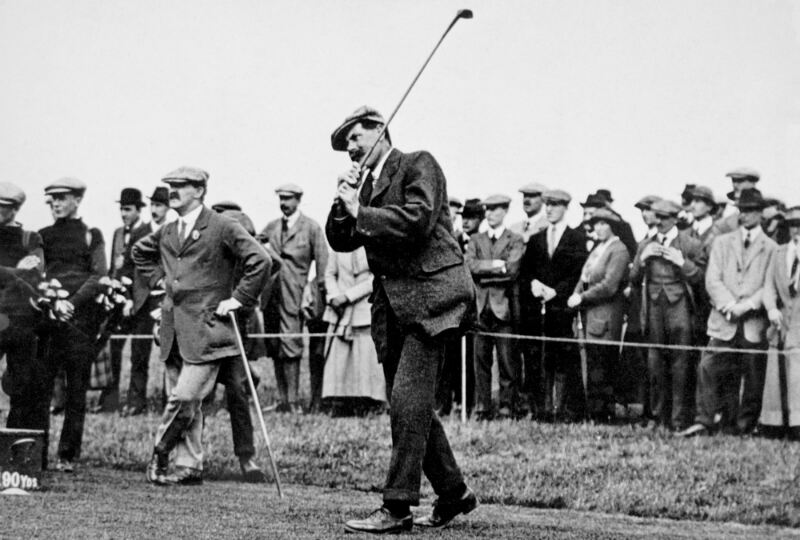 One of his ‘guttie’ balls is tested by James Braid. PA Archive.