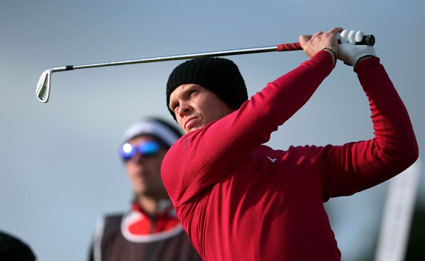 Keeping warm in his red top and hat. Credit Brian Lawless/PA Wire